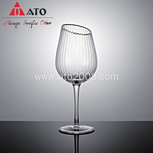 Gold rimmed red wine glasses